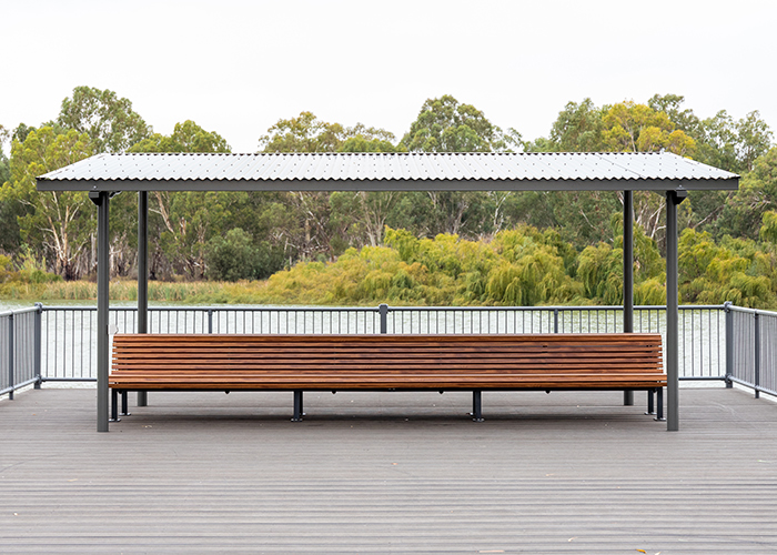 Classic Plaza Back-to-Back Seat with aluminium woodgrain battens in Spotted Gum, Sable Bass frame.