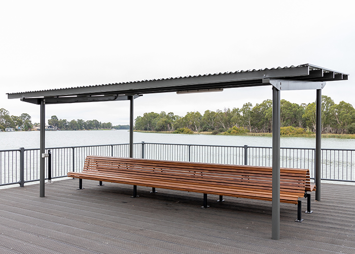 Classic Plaza Back-to-Back Seat with aluminium woodgrain battens in Spotted Gum, Sable Bass frame.