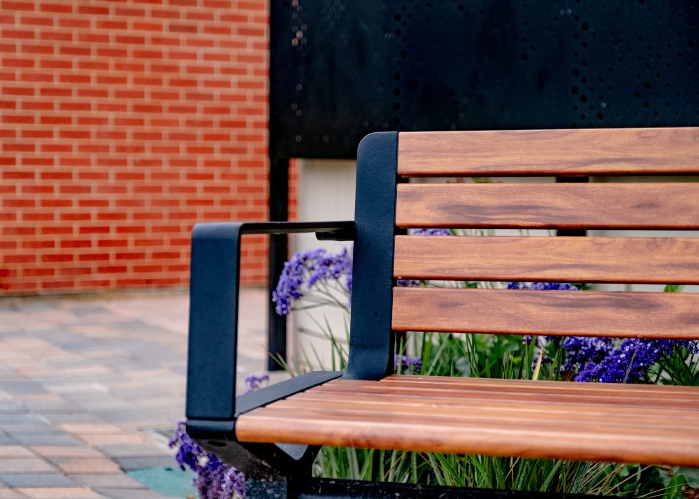 Aria Seating System (CMA), aluminium woodgrain battens in Spotted Gum, Textura Night Sky frame.