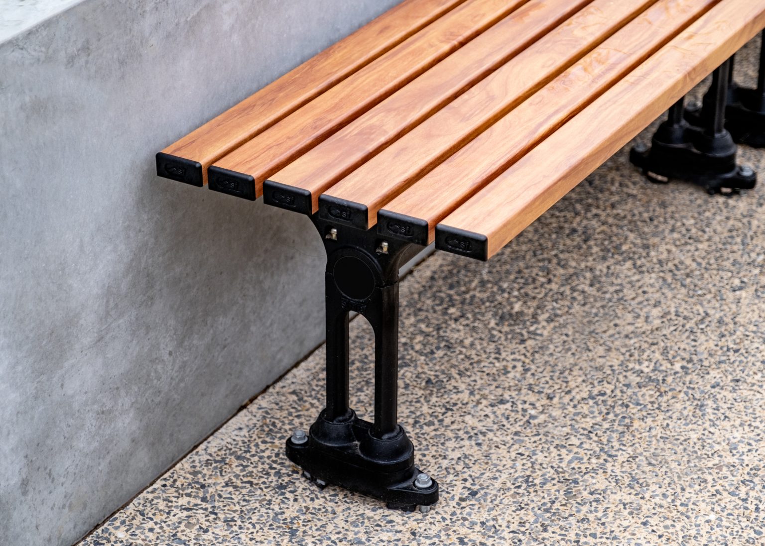 Mall Slim Bench (CMM8), aluminium woodgrain battens in Spotted Gum, Textura Night Sky frame.