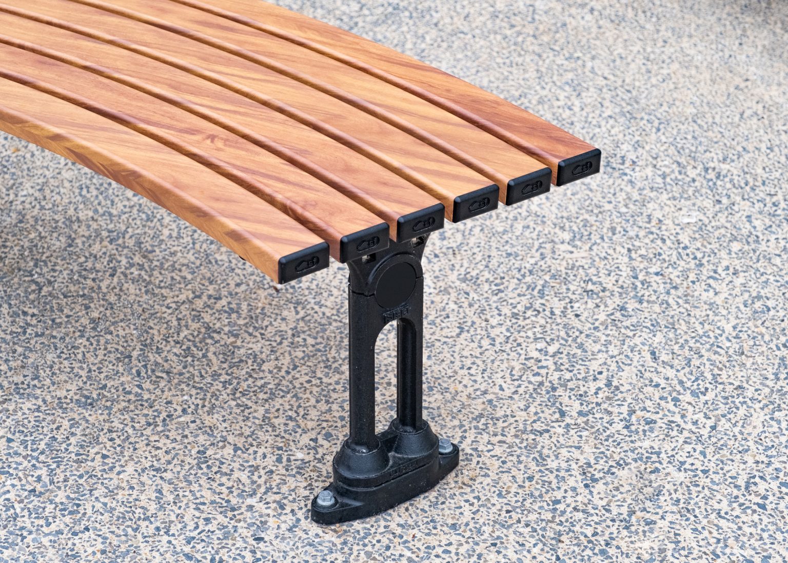 Mall Curved Slim Bench (CMM8-C), aluminium woodgrain battens in Spotted Gum, Textura Night Sky frame.