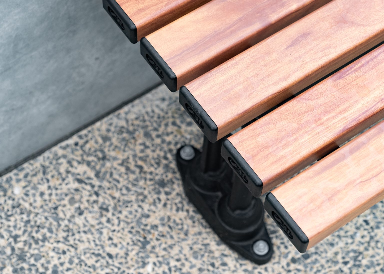 Mall Slim Bench (CMM8), aluminium woodgrain battens in Spotted Gum, Textura Night Sky frame.