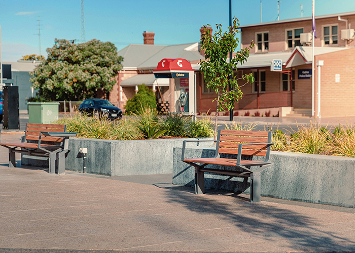 Aria Seat (CMA1, 1200mm) with aluminium woodgrain battens in Spotted Gum, and Sable Brilliance frame.