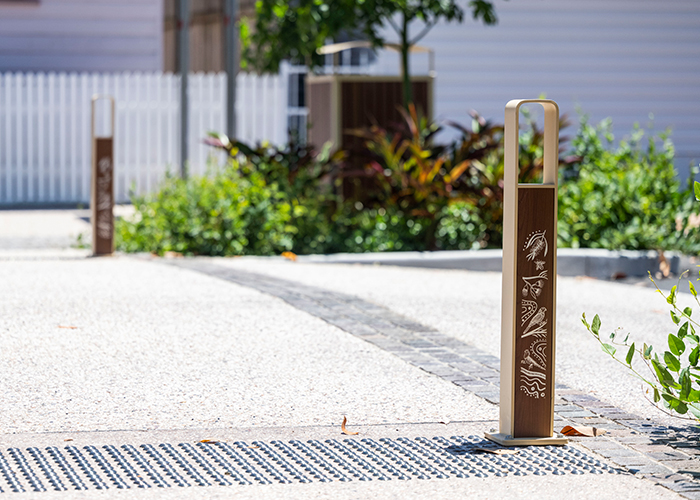 Linea Bollard (B6) with etched artwork, aluminium Bush Cherry insert, Textura Doe Skin frame.