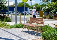 Aria Seat (CMA1, 1800mm) with Splay leg and arm, aluminium Bush Cherry battens, Textura Doe Skin frame.