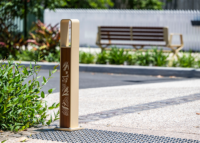 Linea Bollard (B6) with etched artwork, aluminium Bush Cherry insert, Textura Doe Skin frame.