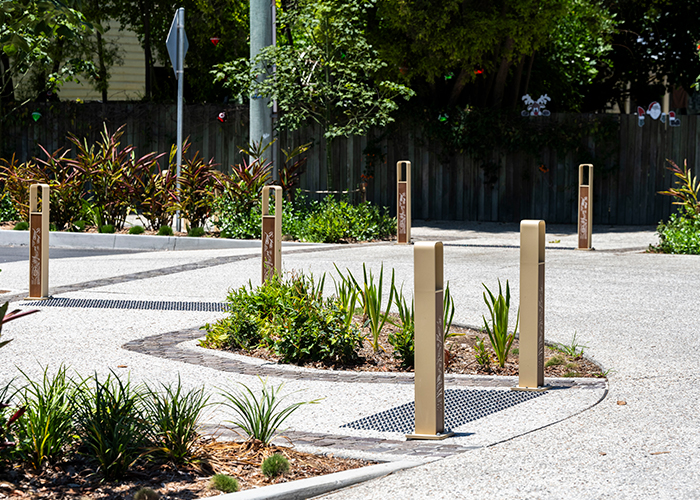 Linea Bollard (B6) with etched artwork, aluminium Bush Cherry insert, Textura Doe Skin frame.
