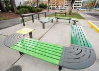 Aria Seating System (CMA4-1B-C90-2B-C90-3B) with Pedestal leg, Shamrock and Viper Green battens, Woodland Grey frames.