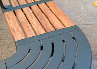 Aria Seating System, woodgrain aluminium battens in Spotted Gum, Textura Monument frames.