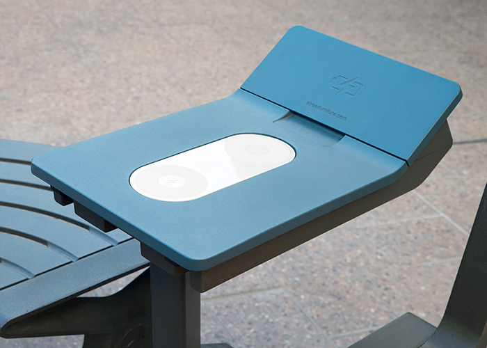 PowerMe Table for outdoor charging, powdercoated in Textura Deep Ocean with Monument frame.