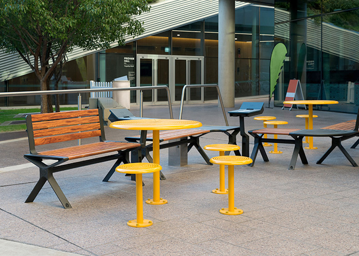 Aria Seating System with Cafe Round Tables and Stools.