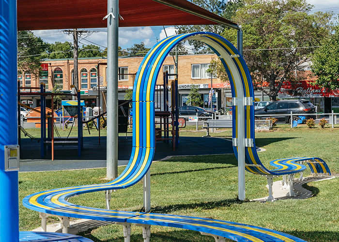 Tailored Mall Curved Slim Bench in Bondi Blue, Jaybird Blue and Brilliant Yellow with Pearl White frame.
