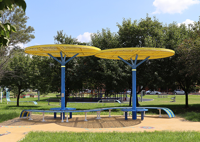 ChillOUT Tree (CT1) with Brilliant Yellow roof, trunk in Bondi Blue. Tailored Mall Curved Slim Bench.
