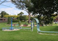 ChillOUT Tree (CT1) with Brilliant Yellow roof, trunk in Bondi Blue. Tailored Mall Curved Slim Bench.