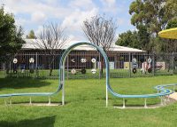 Tailored Mall Curved Slim Bench in Bondi Blue, Jaybird Blue and Brilliant Yellow with Pearl White frame.