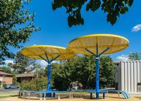 ChillOUT Tree (CT1) with Brilliant Yellow roof, trunk in Bondi Blue. Tailored Mall Curved Slim Bench.
