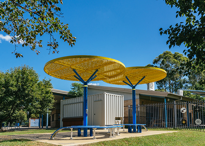 ChillOUT Tree (CT1) with Brilliant Yellow roof, trunk in Bondi Blue. Tailored Mall Curved Slim Bench.