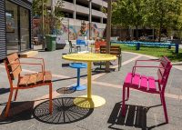 Forum Seats, Cafe Round Table and Stools in Sensation Orange, Telemagenta, Brilliant Yellow, Bondi Blue.