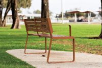 Linea Seat, 1800mm, with arms, aluminium woodgrain Spotted Gum battens, Textura Russet frames.