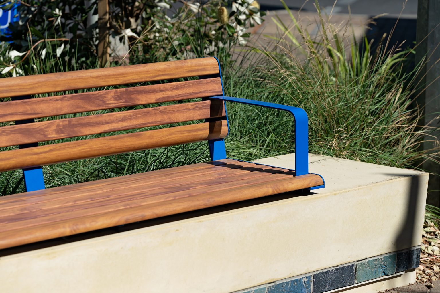 Linea Seat plinth-fixed with aluminium Spotted Gum battens, Jaybird Blue frames.