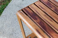 Linea Seat, 1800mm, with arms, aluminium woodgrain Spotted Gum battens, Textura Russet frames.