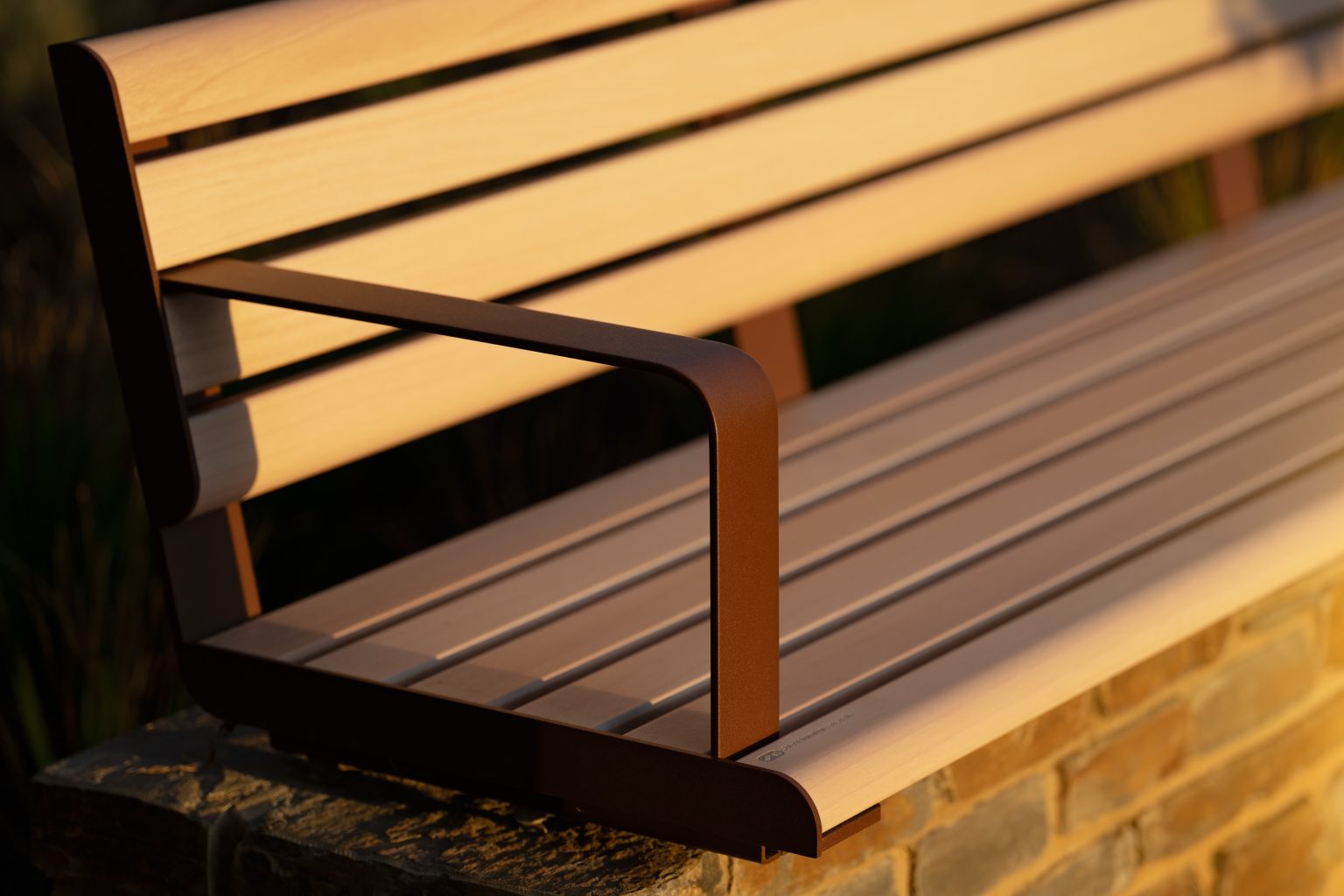 Linea Seat (2100mm, plinth-fixed) with arms, aluminium Curly Birch battens and Textura Core Ten frames.