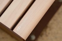 Linea Seat, plinth-fixed, with aluminium Curly Birch battens and Textura Core Ten frames.