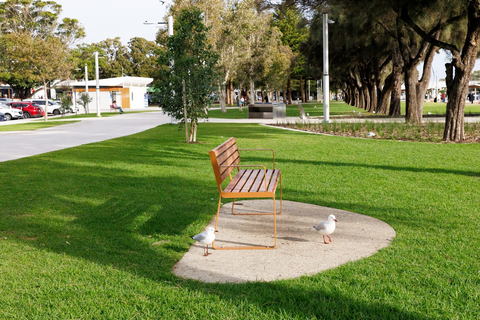 Linea Seat, 1800mm, with arms, aluminium woodgrain Spotted Gum battens, Textura Russet frames.