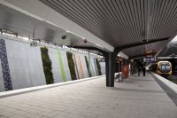 Concourse seats and living green walls on the platform