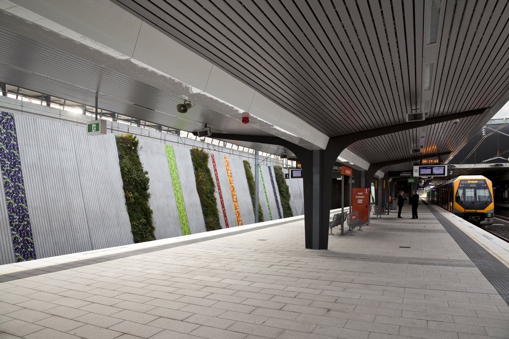 Concourse seats and living green walls on the platform