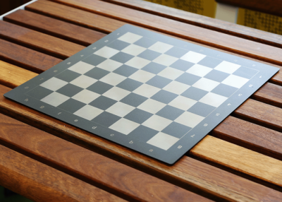 Optional Square Chess Board fixed to Linea Table with eco-certified hardwood battens.