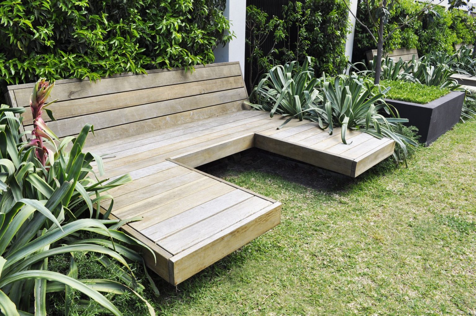 Custom day beds on the lawn at Warleigh Grove, Brighton.