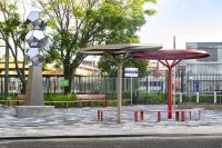 ChillOUT Trees in Textura Jasper and Pioneer Red. Linea Curved Seats and Benches with aluminium Spotted Gum battens, Pioneer Red frames.