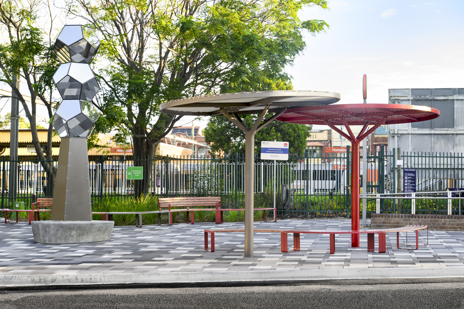 ChillOUT Trees in Textura Jasper and Pioneer Red. Linea Curved Seats and Benches with aluminium Spotted Gum battens, Pioneer Red frames.