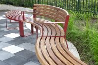 Linea Curved Benches and Seats with aluminium Spotted Gum and Pioneer Red battens, Pioneer Red frames.